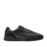 Black Cole Haan Men's GrandPrø Turf 2.0 sneakers with smooth leather upper, suede-like accents, and geometric stitching.