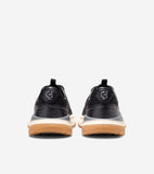 Black golf shoes, back view. Mesh upper, black heel with embossed 'CH' logo, gray and cream layered midsole, brown outsole.