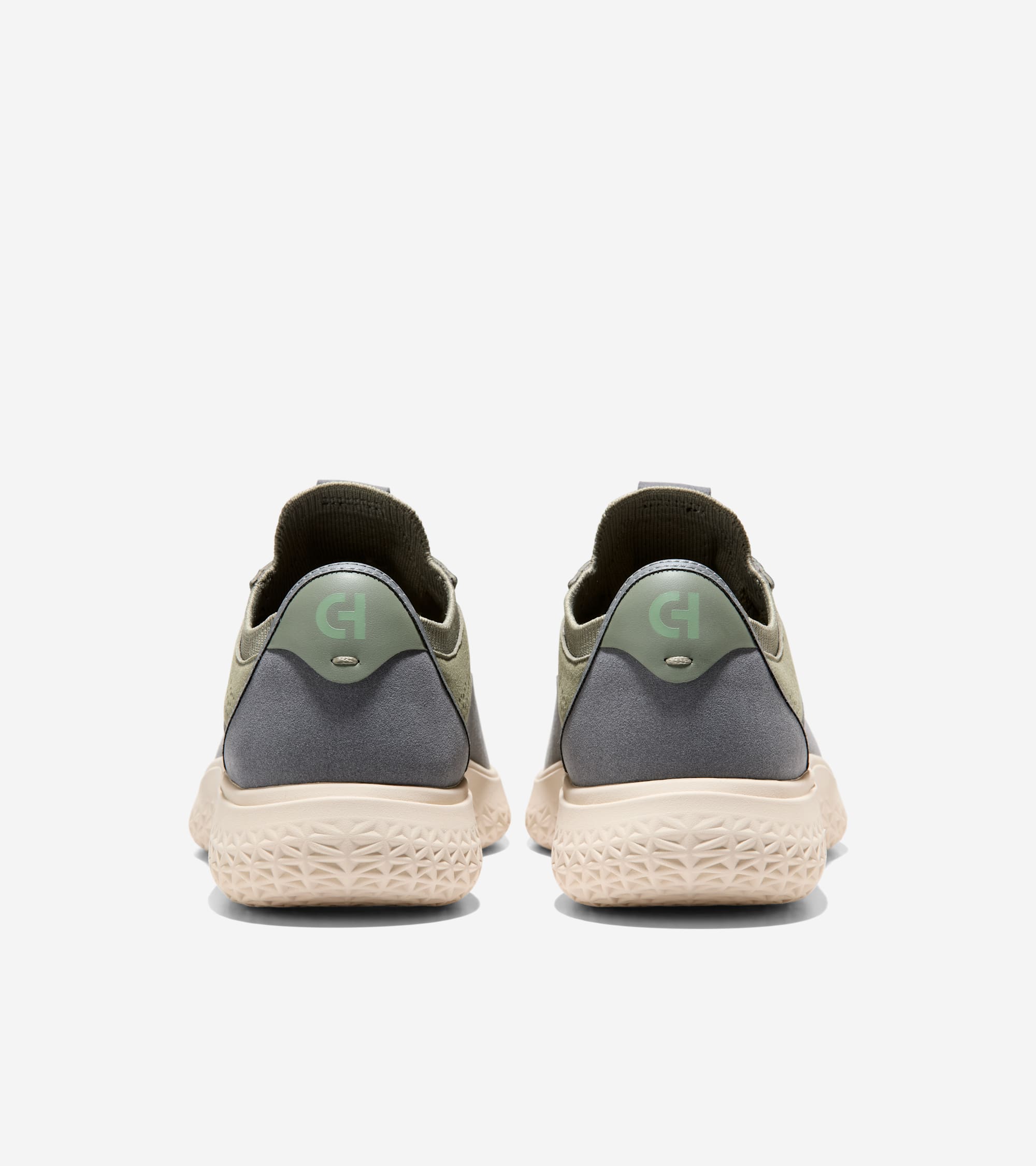 Back view of olive green knit sneakers with gray panels, light green 'CH' logo heel tabs, and textured light beige soles.