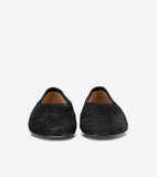 Black quilted ballet flats with a chevron pattern, rounded toes, and a light brown interior lining.