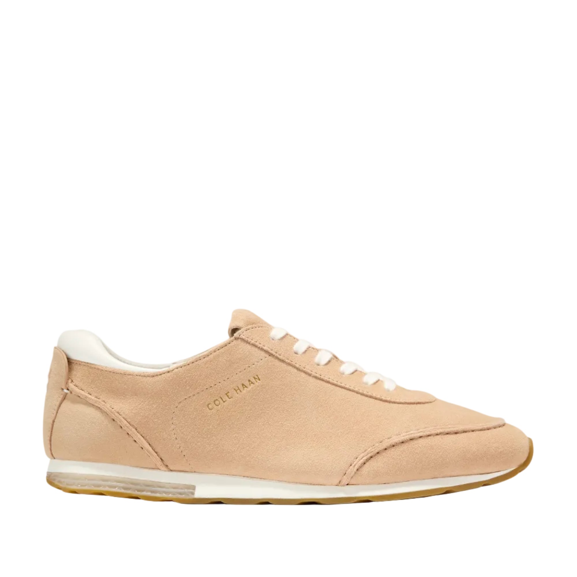 Light beige suede low-profile women's sneakers with white laces, white heel accent, white midsole, and gum rubber outsole.