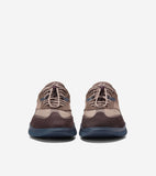 Pair of men's sneakers with dark brown and taupe suede and mesh uppers, blue side accents, bungee laces, and navy soles.