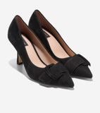 Pair of black suede pointed-toe pumps with mid-height block heels and a rectangular suede buckle on the vamp of each shoe.