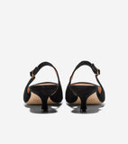 Black suede slingback pumps with kitten heels and gold-toned buckles, viewed from the back.