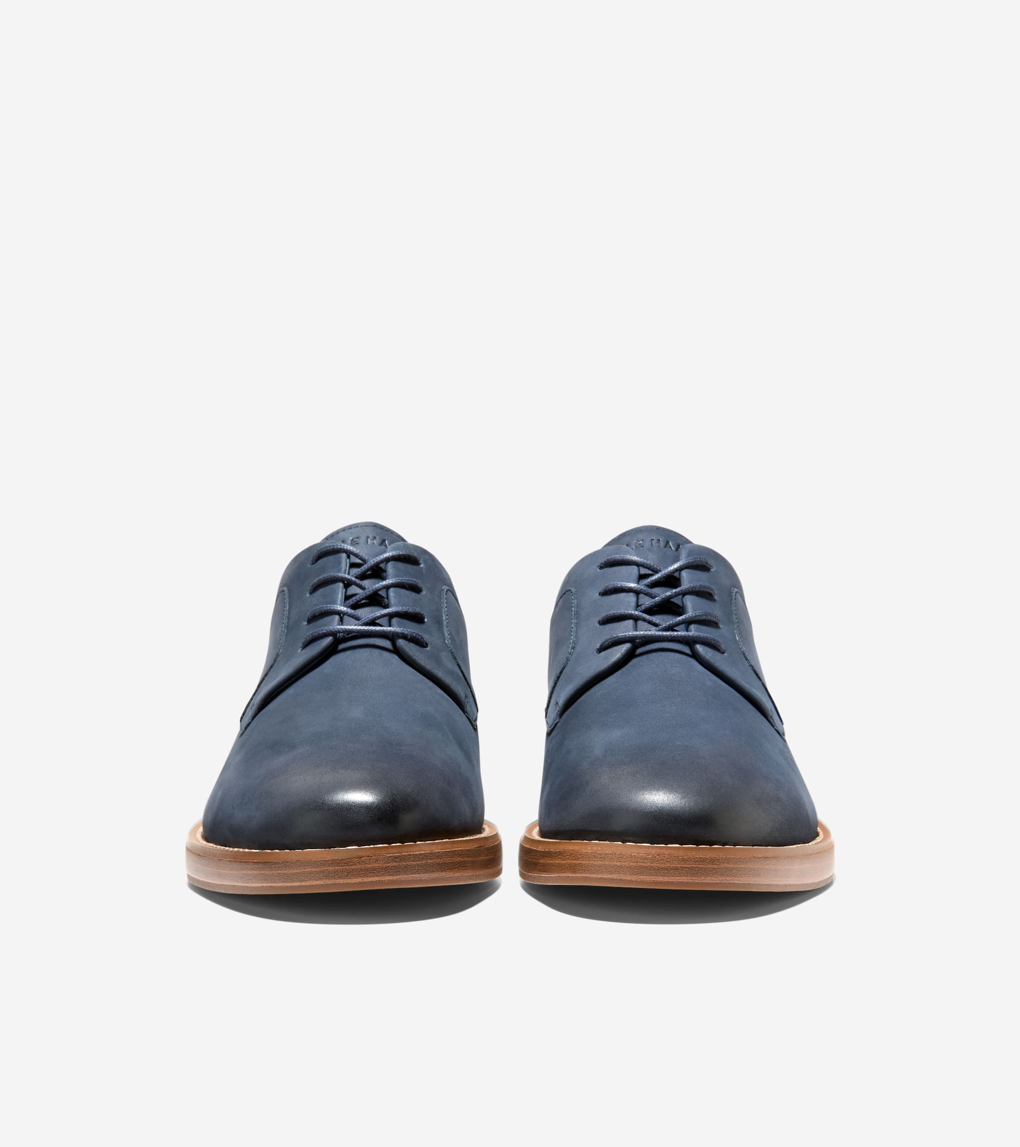 Dark blue plain toe oxfords with matching laces, subtle darkened toe, and light brown soles.
