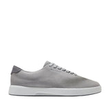 Light grey Cole Haan Men's GrandPrø CitySpectre Laser Sneakers with perforated toe and white sole.
