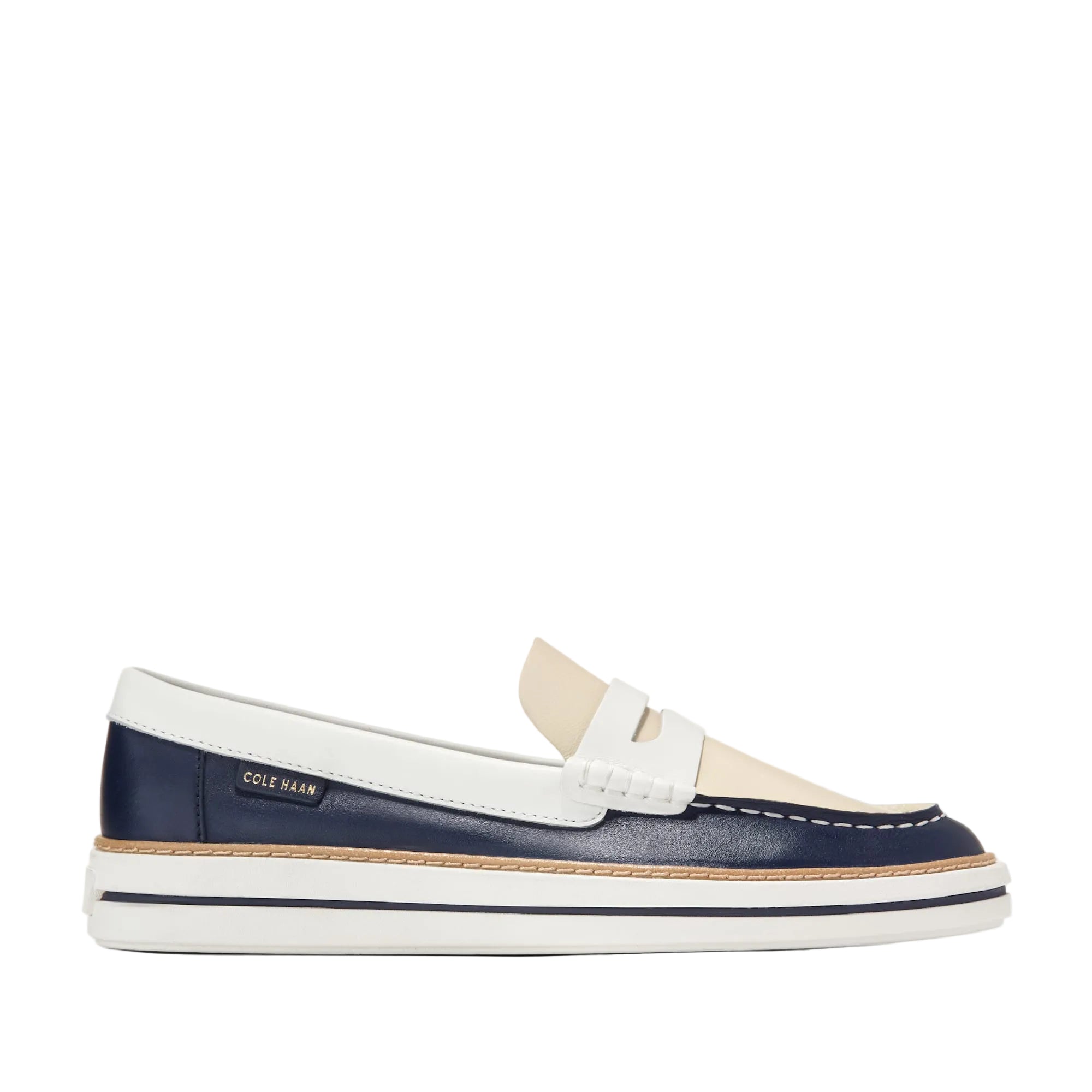 Navy blue and white leather penny loafer with a cream vamp and a white platform sole, shown from the side.