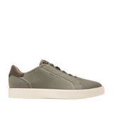 Olive green knit slip-on sneakers with a cream sole and dark brown leather heel accent.