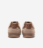 Pair of light brown suede sneakers with dark brown leather heel tabs featuring an embossed 'CH' logo, and dark brown soles.