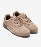 Pair of tan suede sneakers with matching laces, brown heel tabs, a white midsole stripe, and subtle stitching details.