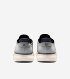 Pair of grey oxfords with dark blue collars, thick cream soles, and 'CH' logos on the heels. 'COLE HAAN' is embossed on the s