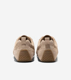 Pair of beige suede sneakers, back view, with fabric heel tabs and tan rubber soles featuring a diamond pattern and Cole Haan
