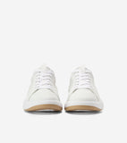 Pair of white low-top sneakers with mesh uppers, white laces, white midsoles, and brown gum outsoles, viewed from the front.