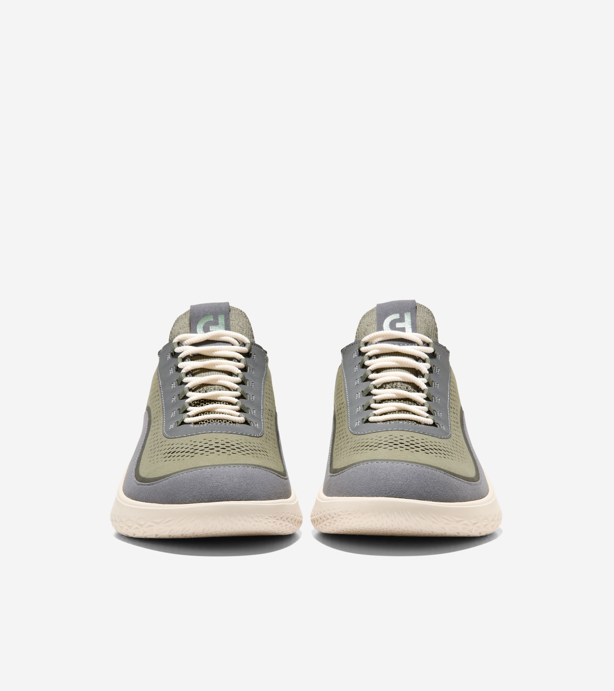 Olive green mesh sneakers with gray trim, cream laces, and a textured cream sole. Gray tongue with light green logo.