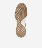 Tan sneaker sole with white midsole edge, featuring a textured pattern of wavy squares and a central wavy design. 'COLE HAAN