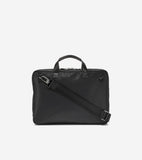 Black nylon slim briefcase with two leather top handles, a detachable fabric shoulder strap with silver-toned hardware, and a