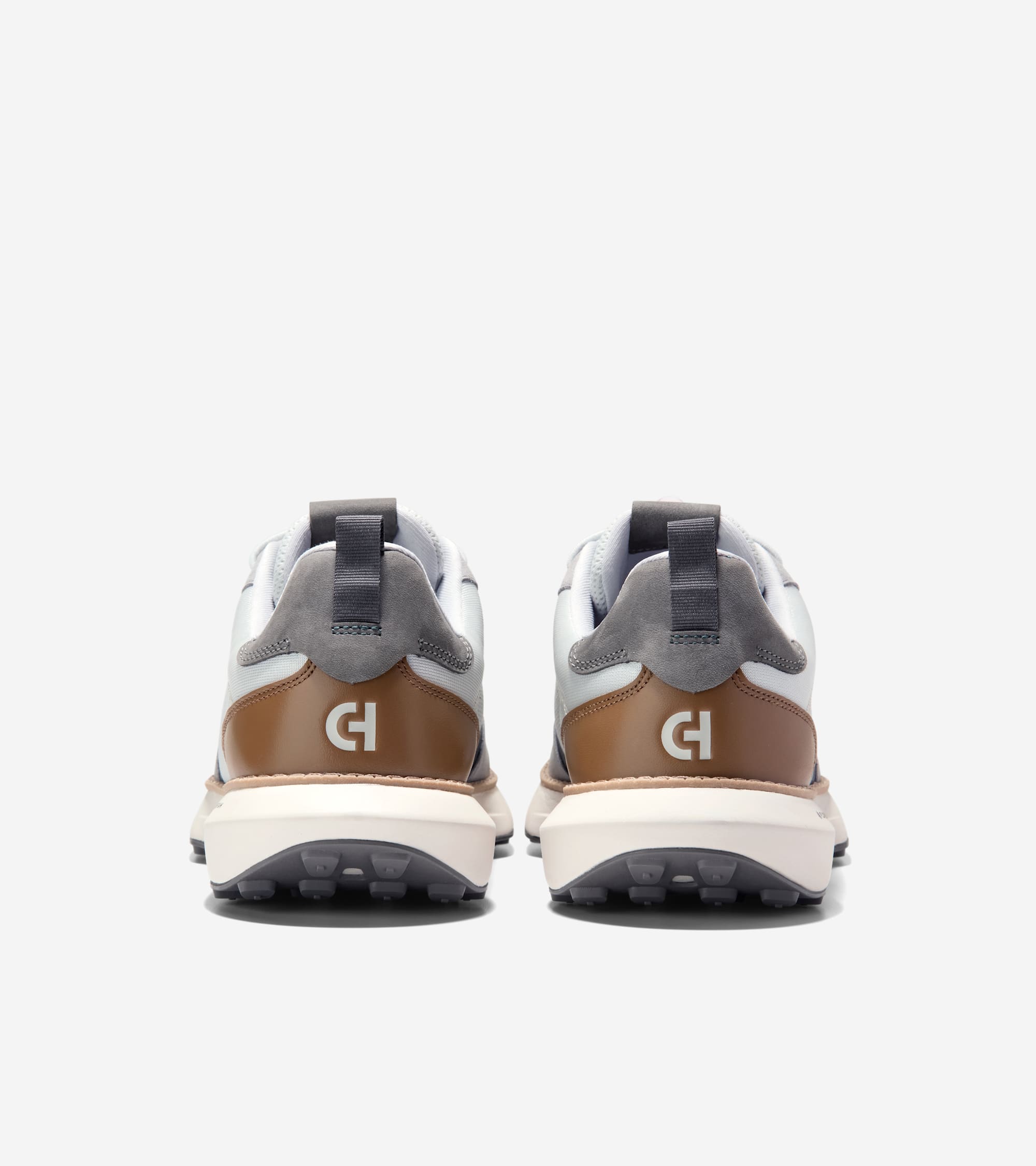 Pair of white, gray, and brown sneakers with gray suede accents, chunky off-white midsoles, and dark gray outsoles. White 'CH