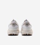 Pair of white mesh sneakers with beige heel counters featuring a dark grey 'CH' logo, white pull tabs, and thick ridged cream