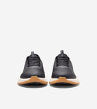 Dark gray textured golf shoes with black laces, off-white midsoles, and tan outsoles. Cole Haan logo on tongue.