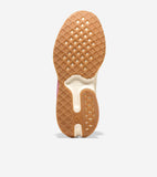 Brown rubber sneaker sole with diamond grid pattern, cream midsection, hexagonal heel, and 'Cole Haan' text. Pink upper.