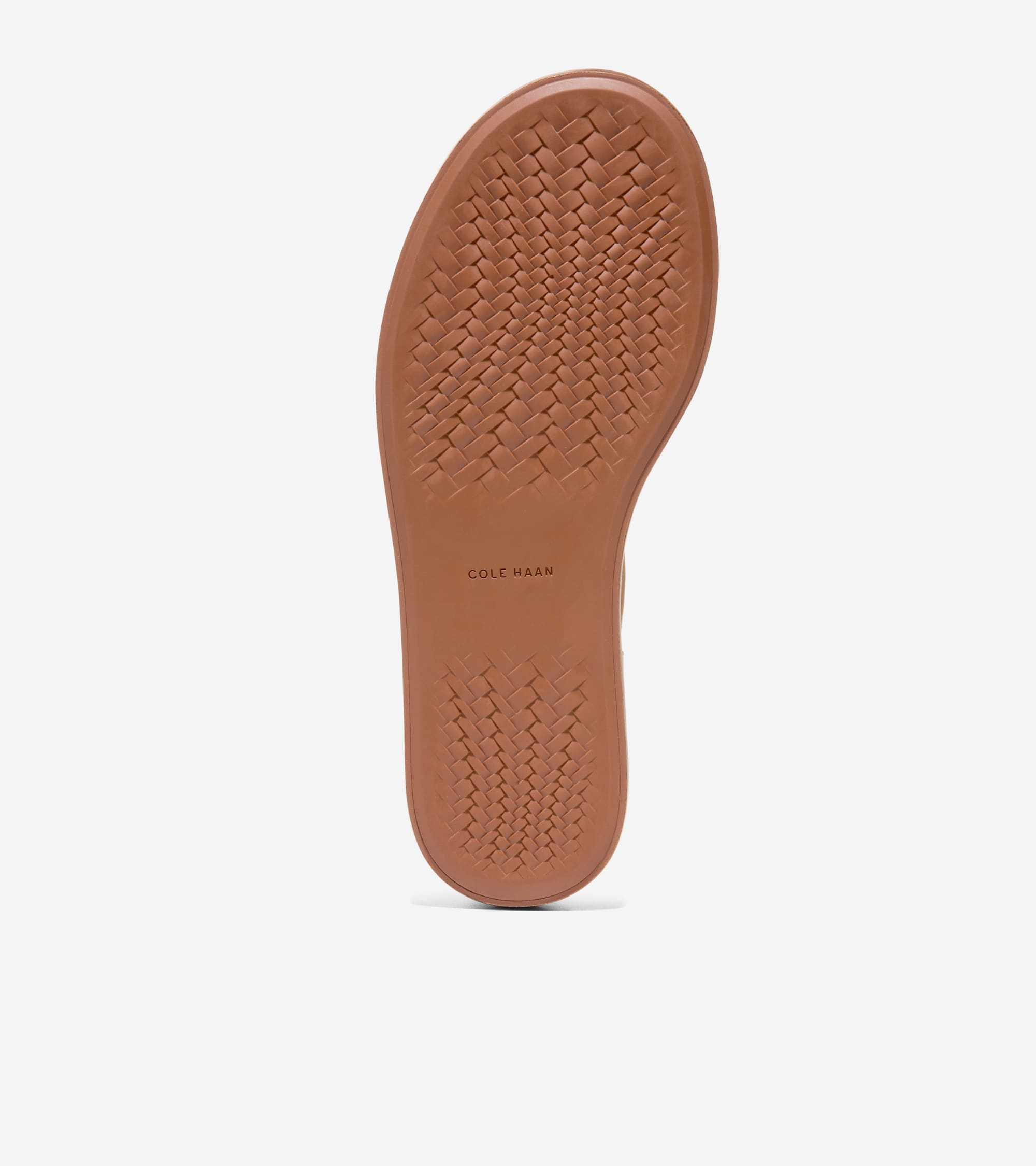 Brown rubber sandal sole with a woven traction pattern. 'COLE HAAN' is embossed near the arch.