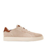 Pair of men's Cole Haan GrandPrø Luxe slip-on sneakers in light beige knit with brown leather accents and an off-white sole.
