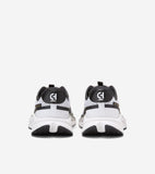 White and black running sneakers with mesh uppers, black heel collars featuring white 'CH' logos, and gold-toned 'COLE HAAN'