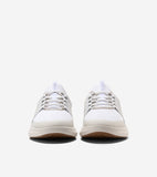 Pair of white ribbed knit sneaker oxfords with off-white midsoles, light brown outsoles, white laces, and metal eyelets.