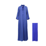 A front-facing view of a Bazzah Couture cornflower blue abaya with scalloped embroidery on the lapels and a matching blue Sheila.