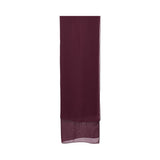A close-up of a deep plum-colored sheer chiffon Sheila (headscarf) with a fine hem finish.