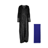 Front view of a Bazzah Couture black crushed velvet wrap abaya featuring silver embroidered cuffs and a cobalt blue chiffon sheila.