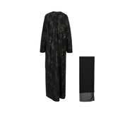 Rear view of the Bazzah Couture printed abaya showing the full-length drape and leaf motif.