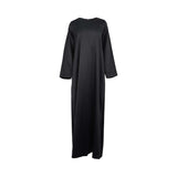 A minimalist black satin long-sleeved maxi dress with a round neckline.