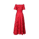 Back view of the red Bazzah Couture embroidered gown showing the square back design, hidden zipper closure, and the intricate lace-like floral pattern.