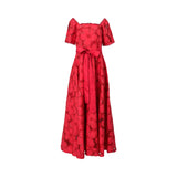 Front view of a red Bazzah Couture maxi dress featuring floral eyelet embroidery, short puff sleeves, and a matching red waist sash belt against a white background.