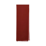 Close-up of the rectangular rust-red chiffon sheila (headscarf) included in the Bazzah Couture set.