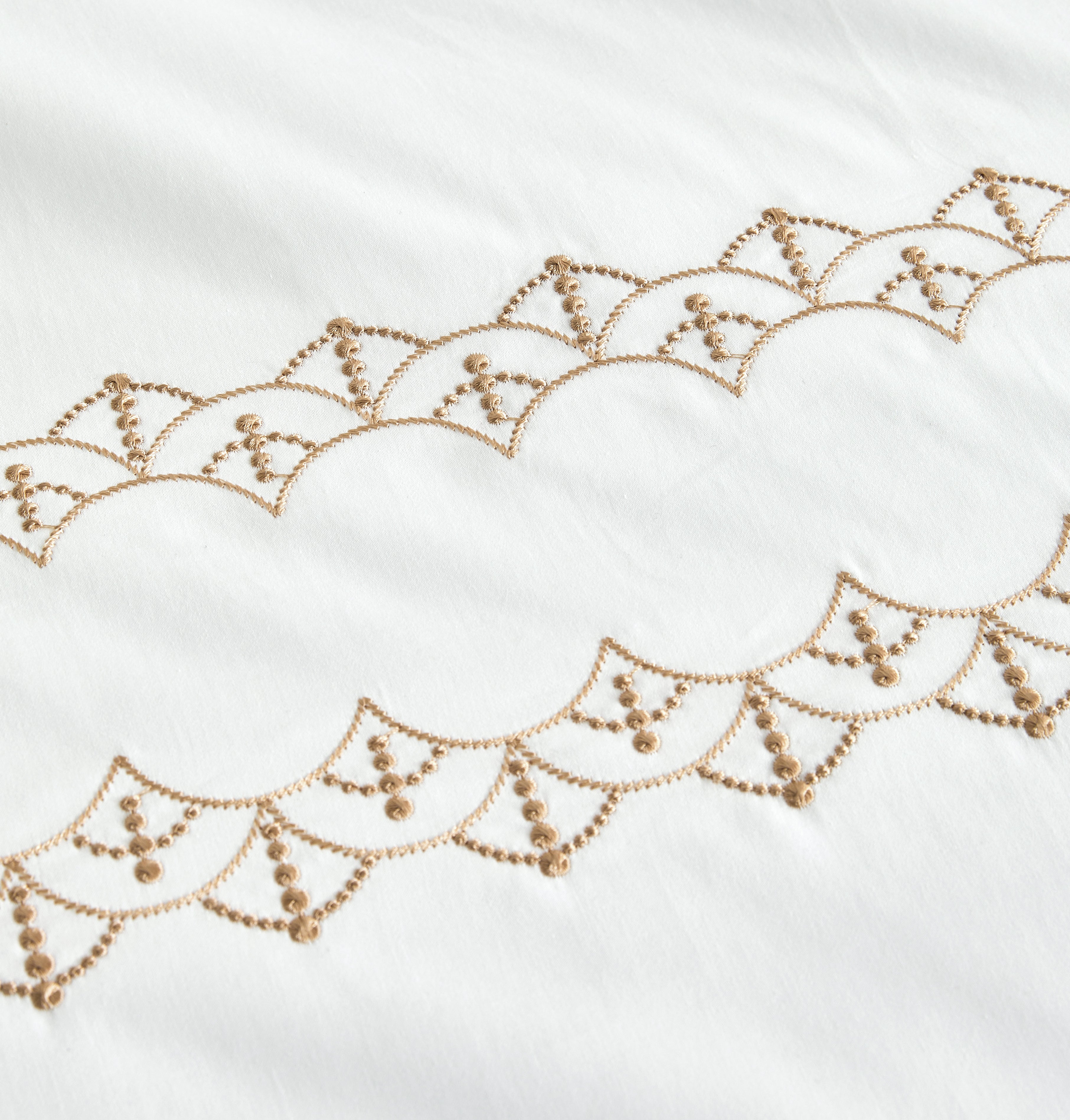 Detailed view of the high-density gold thread embroidery, showcasing the intricate geometric pattern and premium finish.