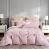 Frontal view of a luxury bed set with sophisticated grey and silver botanical embroidery.