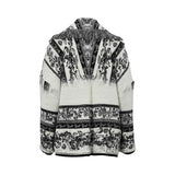 Rear view of the tapestry knit jacket showing the continuation of the black scrollwork pattern and the V-shaped fringe detail across the upper back and shoulders