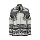 Front view of a cream and black tapestry knit jacket featuring intricate baroque patterns, a tiered charcoal fringe across the chest and shoulders, and decorative crystal floral appliqués on the lapels