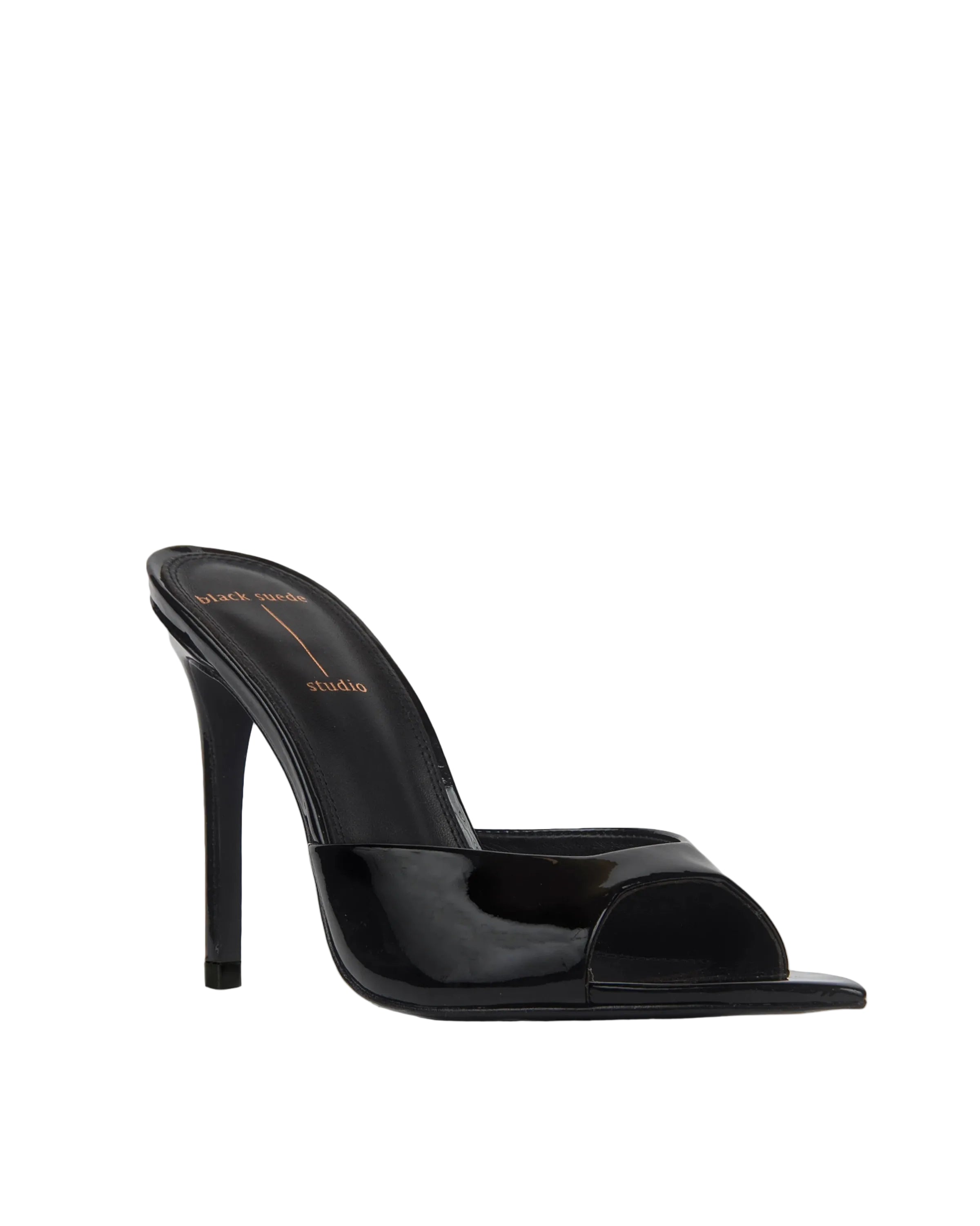 Angled front view of the mule, emphasizing the wide patent strap and the modern, open-toe pointed base.