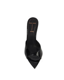 Top-down view of Brea mule, showing the "black suede studio" logo on the black footbed and the architectural pointed toe.