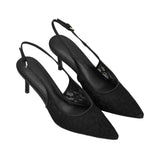 A pair of black pointed-toe slingback pumps with a textured lace overlay and a slim heel, shown on a plain white background.