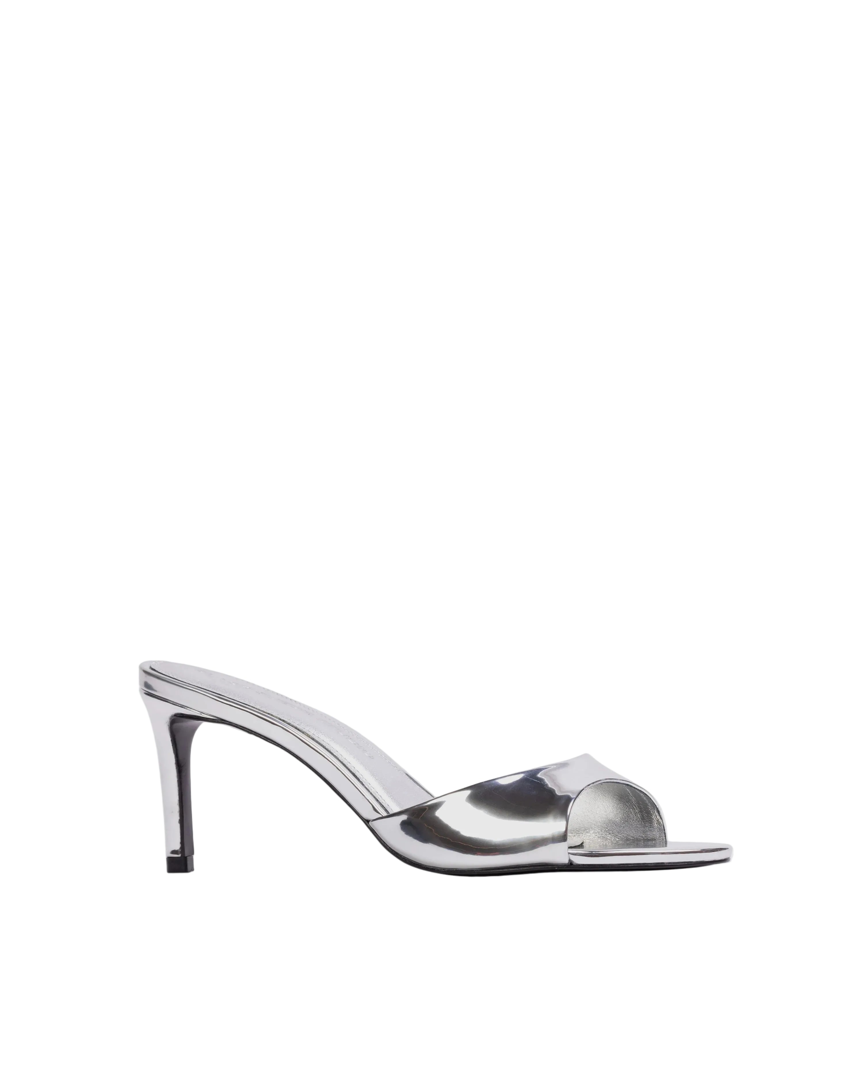 Three-quarter view of a high-shine silver stiletto sandal against a neutral background, highlighting the architectural silhouette and mirror-like finish.