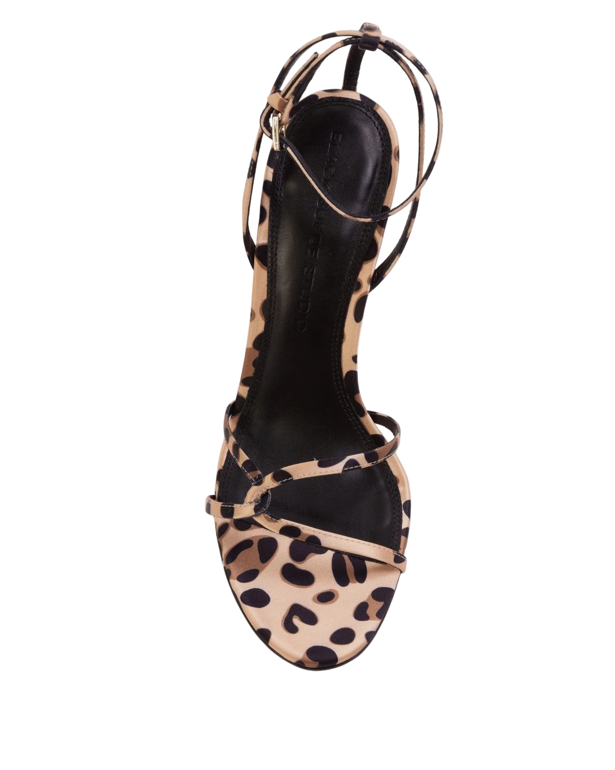 Overhead shot of a Black Suede Studio leopard print sandal featuring a black leather insole and an intricate multi-strap design across the toe.
