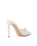 Rear perspective of a white satin stiletto mule showing the smooth heel finish and the natural leather sole against a clean grey background.