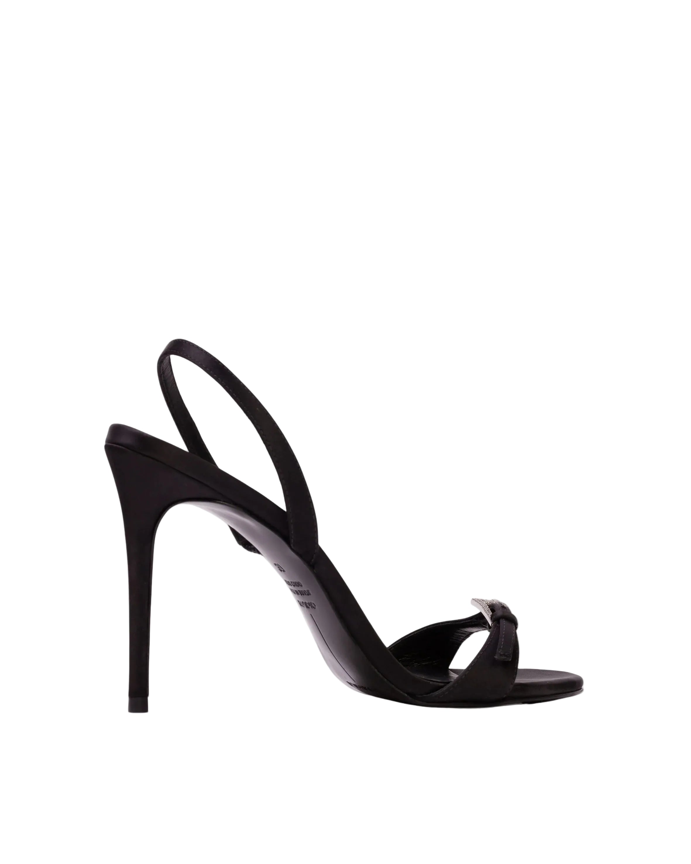 Side profile of a Black Suede Studio black satin slingback high heel shoe featuring a thin stiletto heel and a crystal-embellished buckle on the toe strap.
