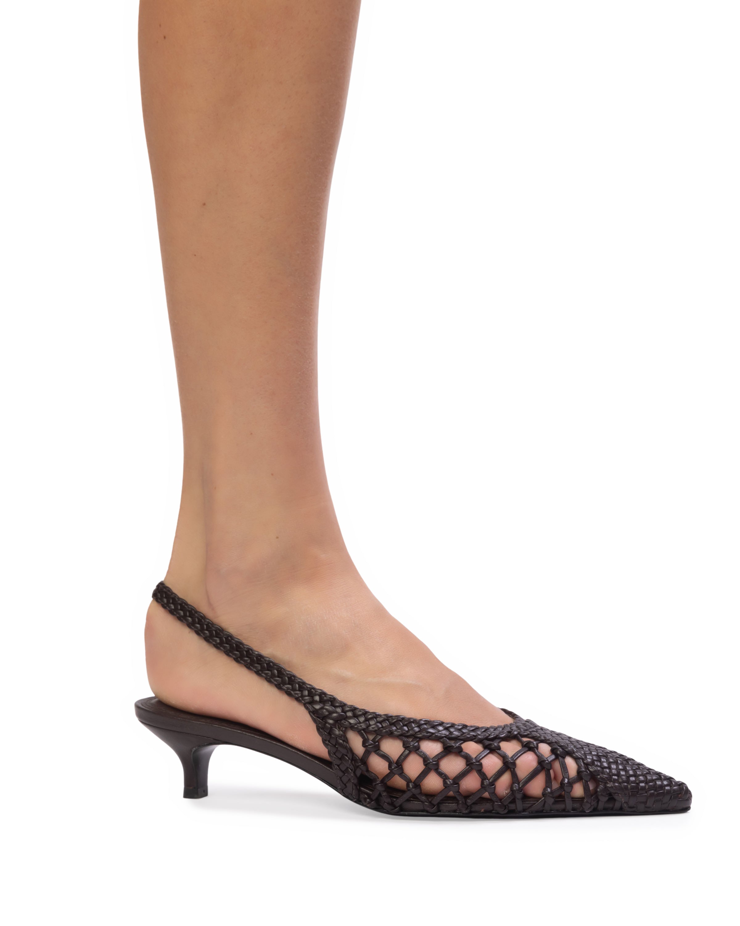 On-model side view of the BLACK SUEDE STUDIO Maggie 35 dark brown woven slingback kitten heel.