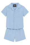 Light blue short-sleeved shirt with a revere collar, four white buttons, and a chest pocket, paired with matching light blue
