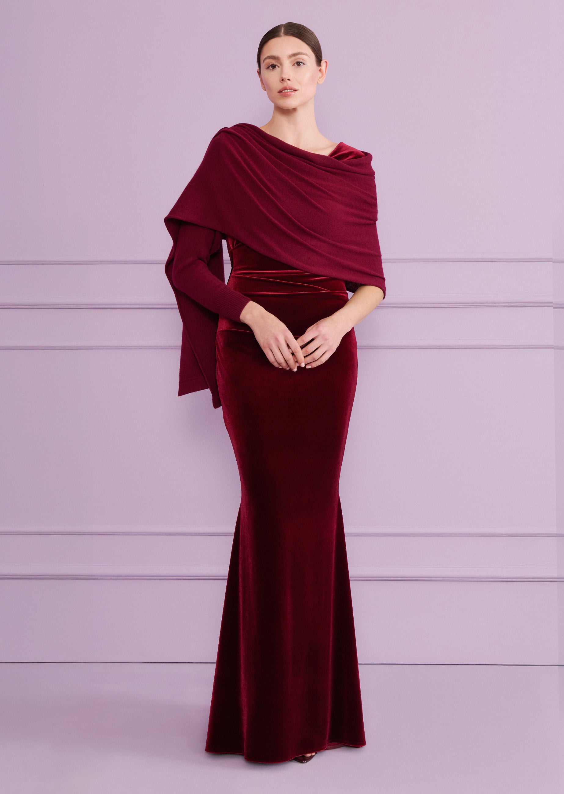 Burgundy velvet long dress with a square neckline, fitted silhouette, and a matching knit-like draped shawl with long sleeves